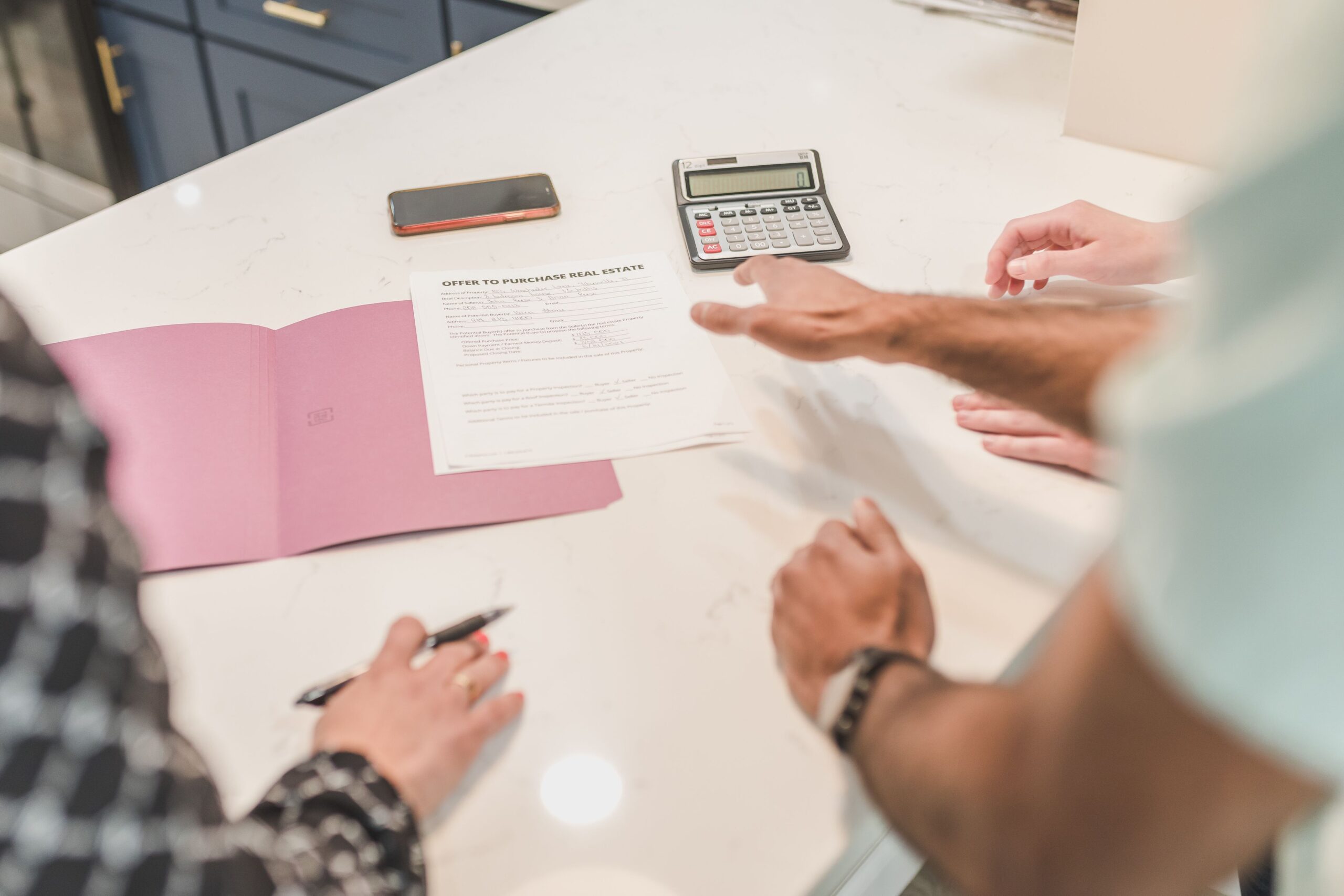 Real estate consultant helping buyers compare homes for sale in Portales